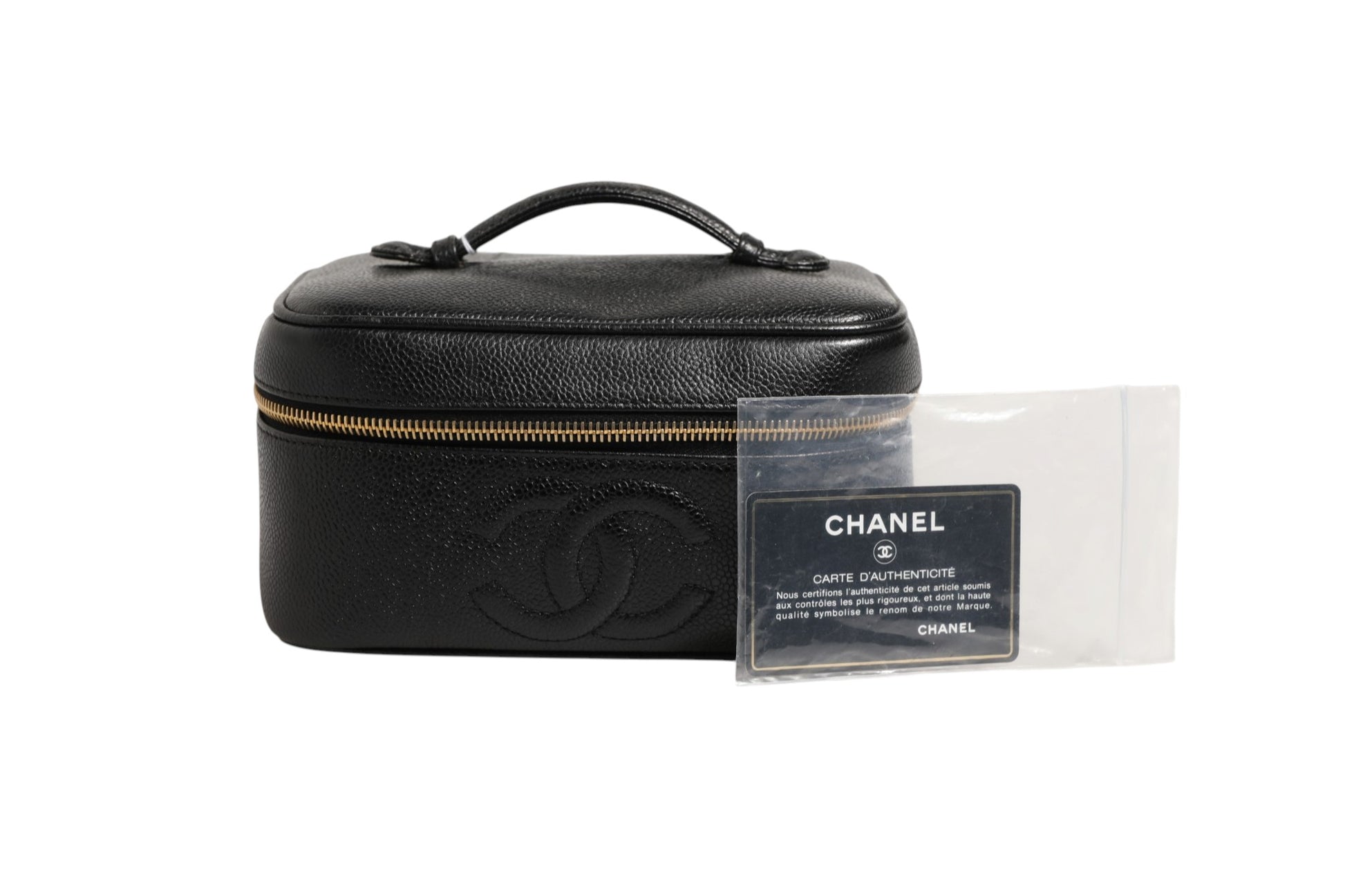 Trousse à maquillage Chanel noire et dorée