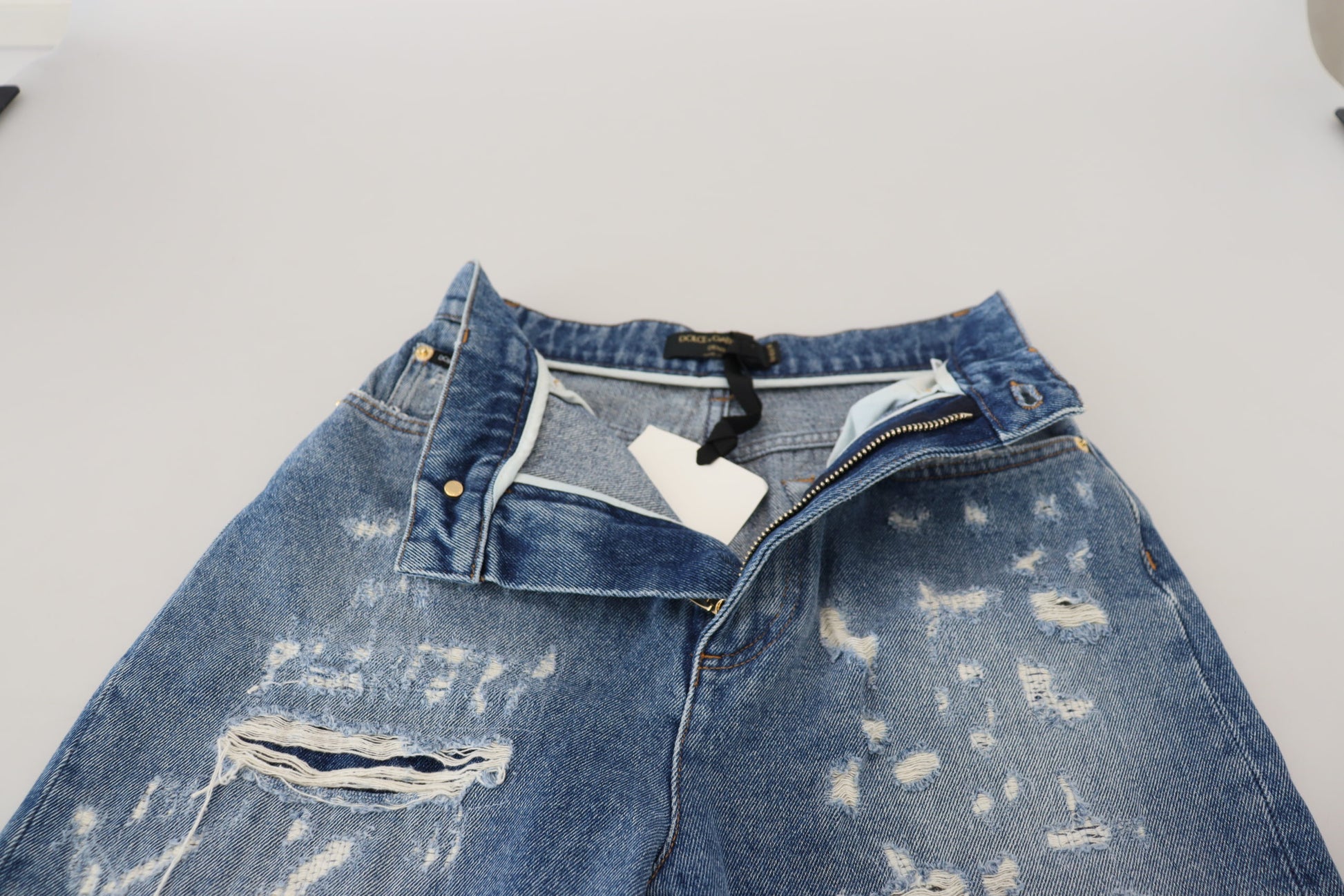 Jean en denim délavé et déchiré en coton bleu Dolce & Gabbana