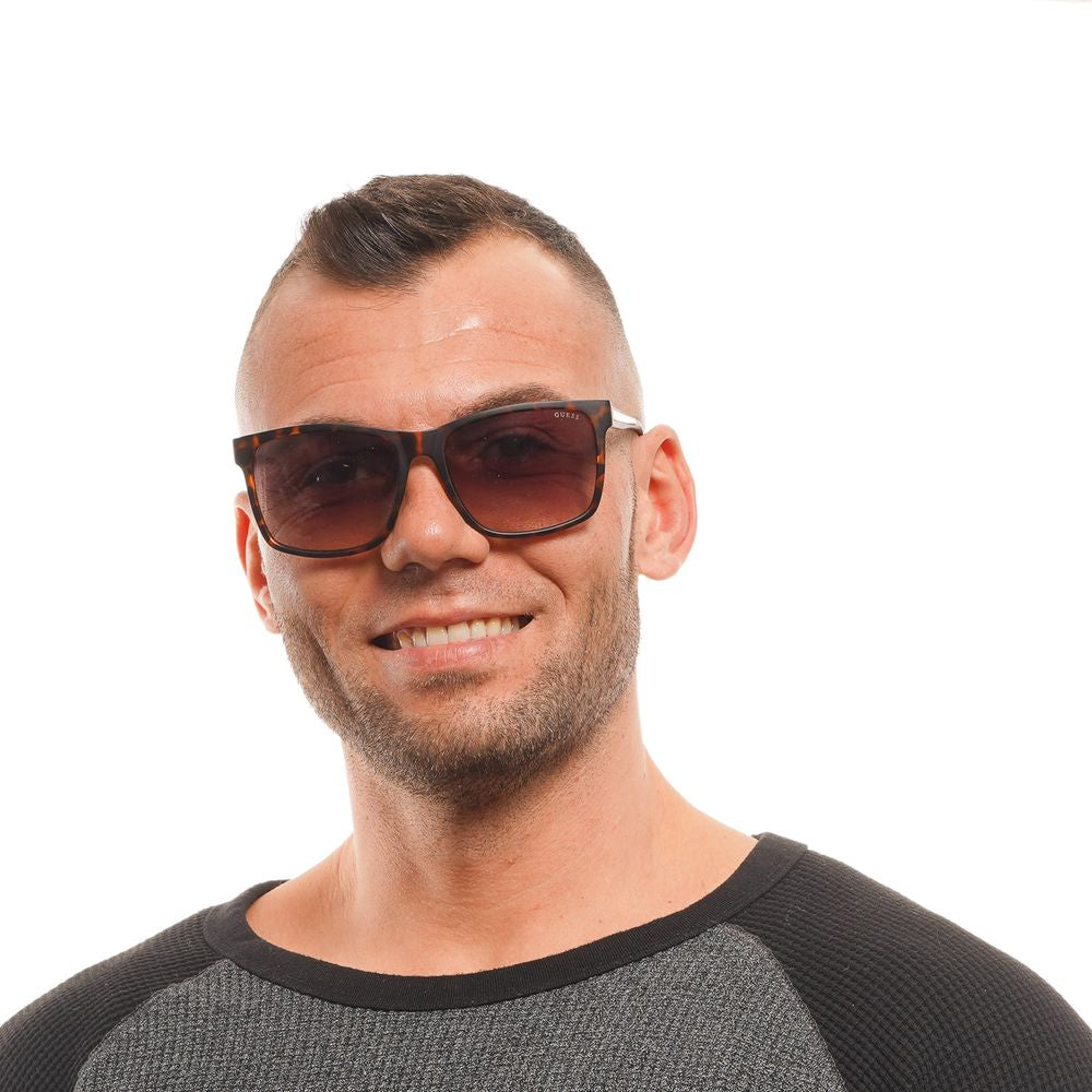 Lunettes de soleil en plastique marron Guess