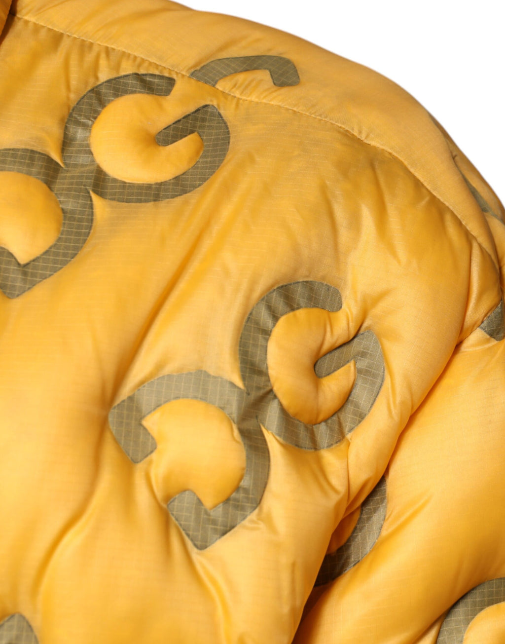Blouson matelassé boutonné Dolce & Gabbana avec logo jaune