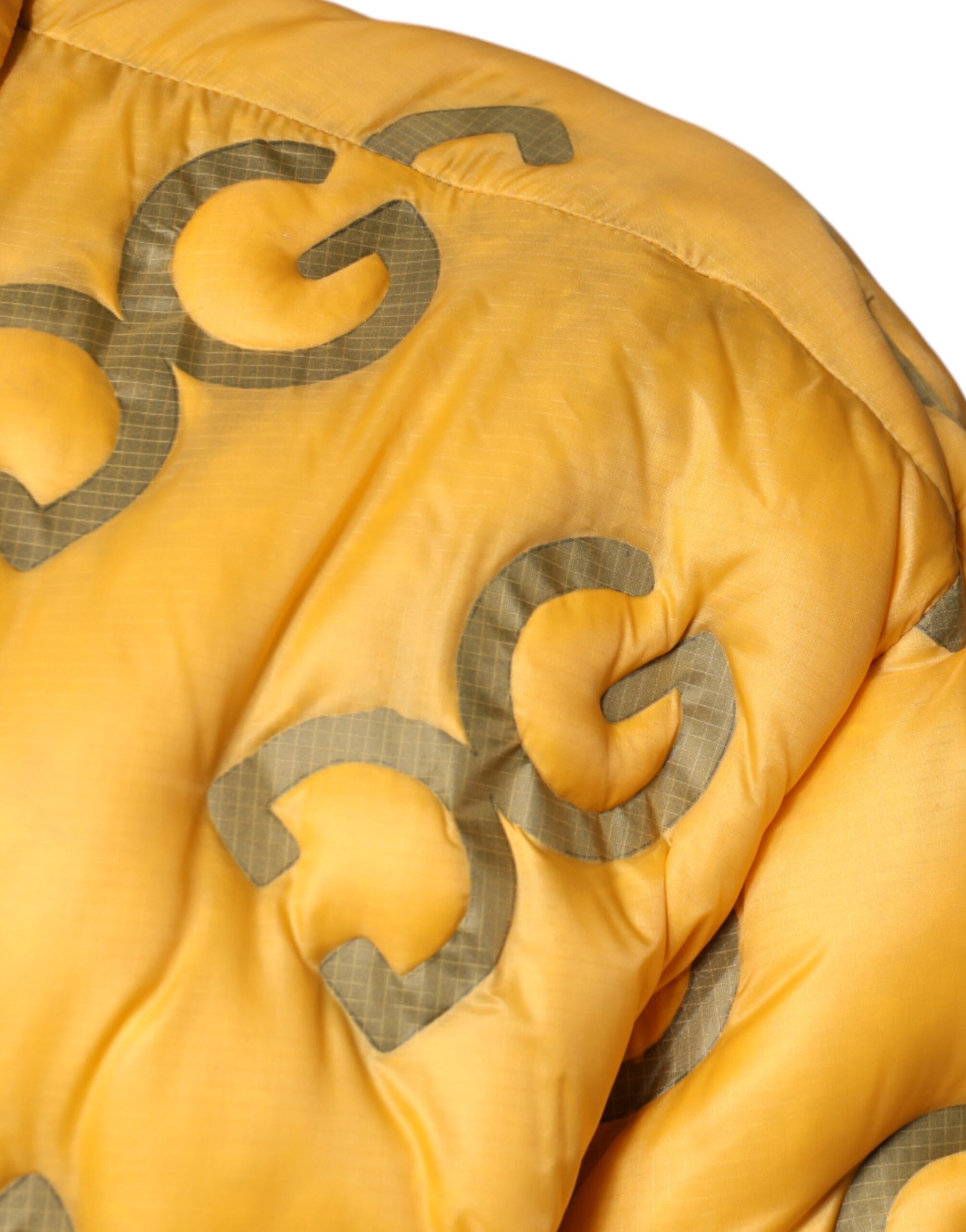 Blouson matelassé boutonné Dolce & Gabbana avec logo jaune